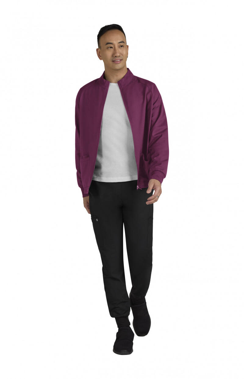 A man models a burgundy jacket with a white shirt and black pants. The jacket features a logo on the chest area. Alpha Mens Jacket - Image 1