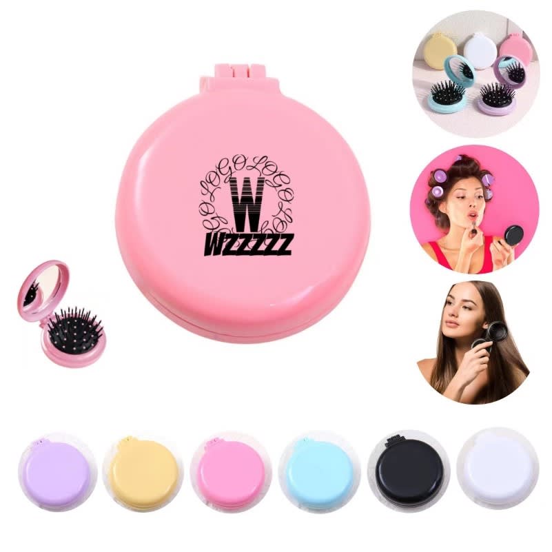 A folding hair brush with a mirror, featuring a pink exterior and various colour options displayed. Folding Hair Brush With Mirror - Image 1