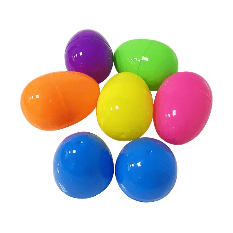 A collection of plastic Easter eggs in orange, purple, green, pink, and blue, stacked together. Easter Egg (Empty) - Image 1