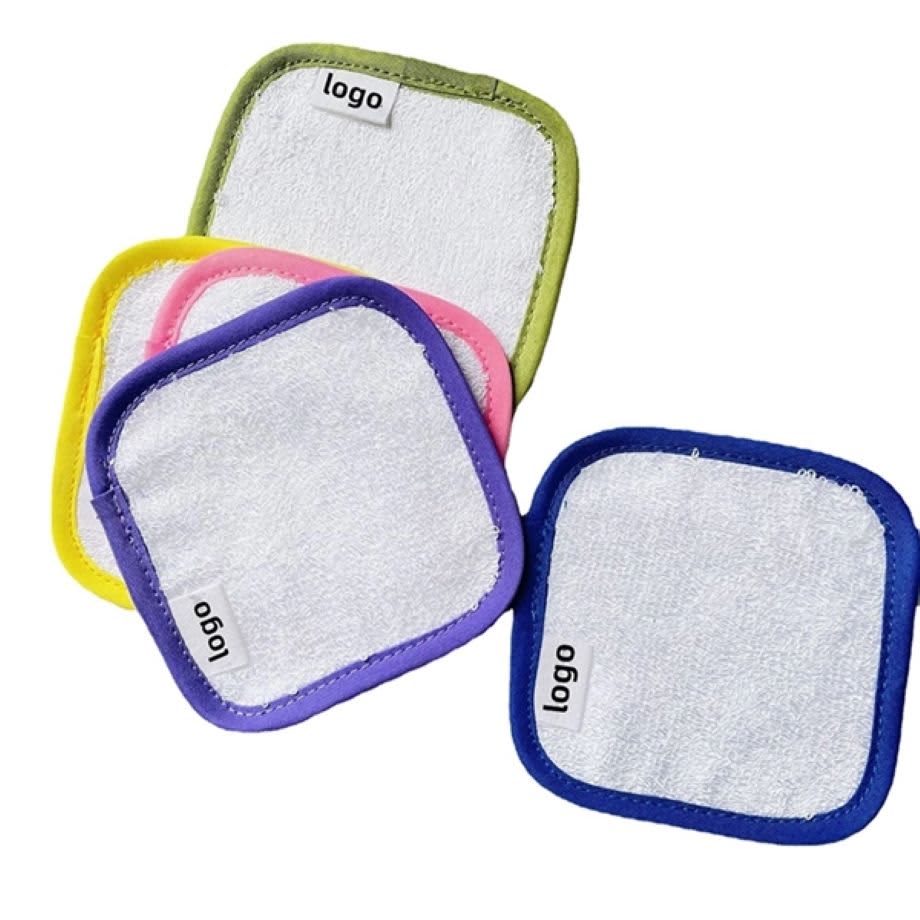A set of square makeup remover pads in white with colourful borders: yellow, pink, green, and purple. Each pad has a logo. Square Lazy Water Makeup Remover Pad - Image 1