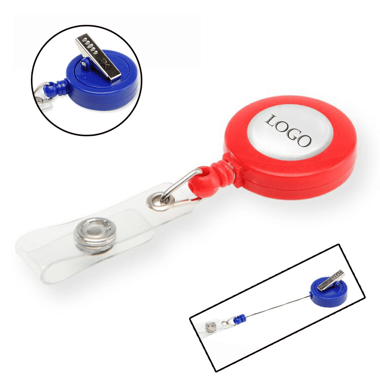 A red and blue retractable badge reel holder with a clear strap and a circular area for a logo. Retractable Round Badge Reel Holder - Image 1