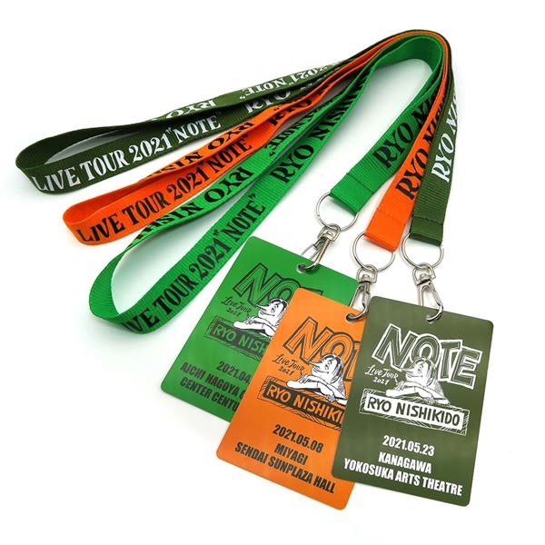 Lanyards in green, orange, and red with PVC cards attached, featuring a logo and event details. Lanyards with PVC Card - Image 1