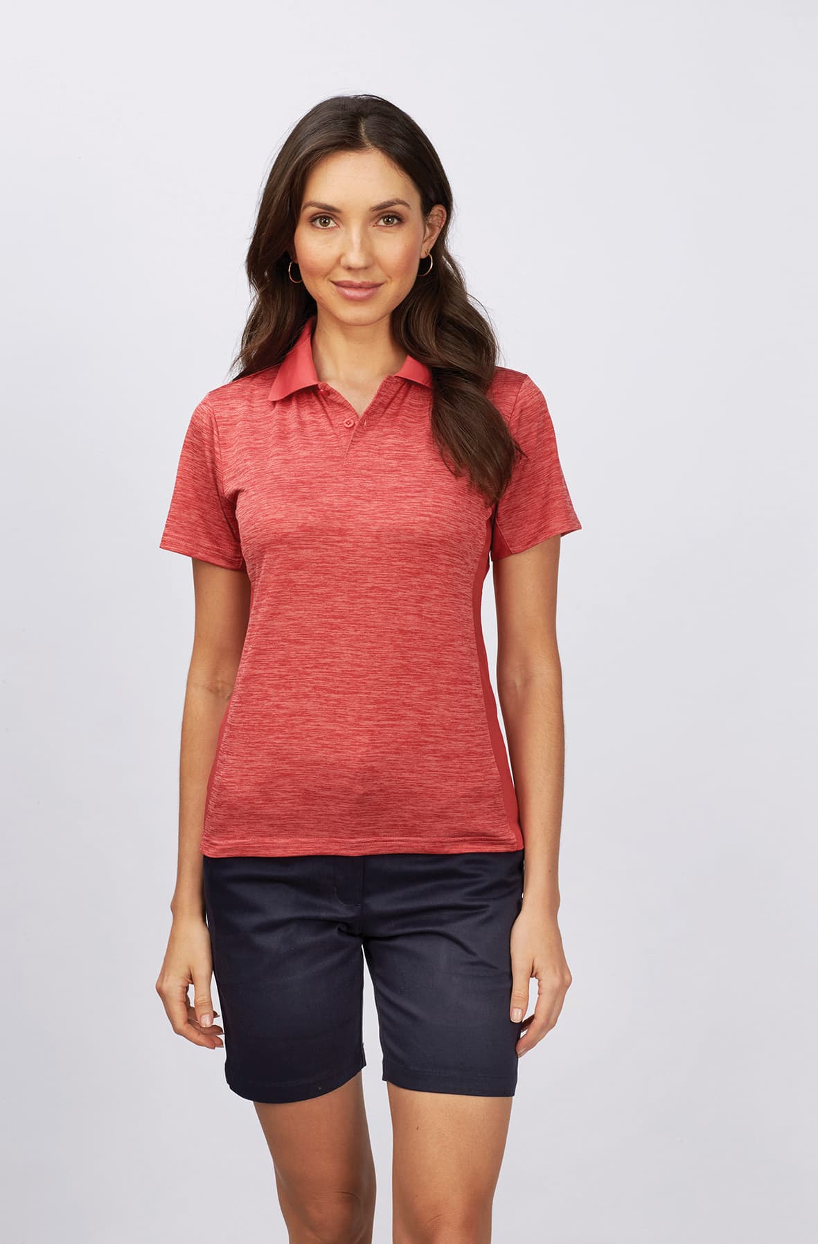 A woman models a red polo shirt paired with navy chino shorts. The outfit features a logo on the shirt. Toby - Ladies Chino Short - Image 1