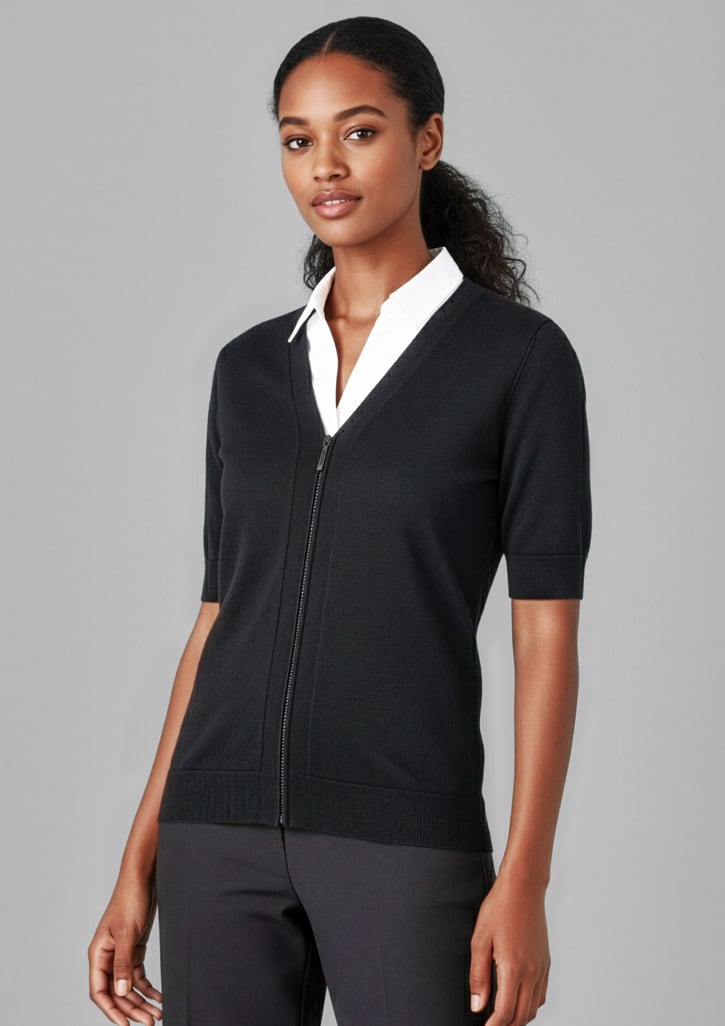 A fitted black short sleeve cardigan featuring a zip front, styled with a white shirt underneath. Womens Zip Front Short Sleeve Knit Cardigan - Image 1