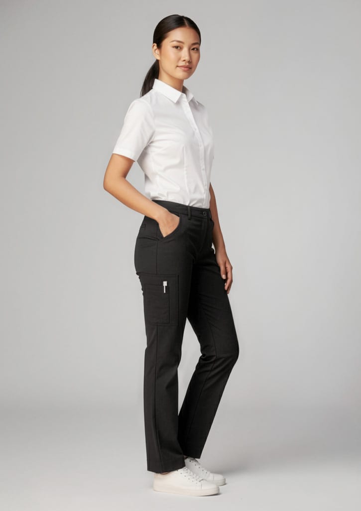 A model wearing black women's comfort waist cargo pants with a white shirt and sneakers, featuring pockets and a logo. Womens Comfort Waist Cargo Pant - Image 1