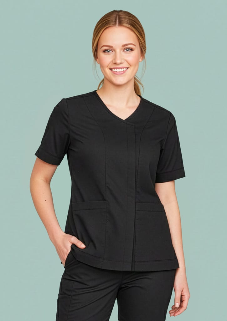 A black women's scrub top featuring a zip front and crossover design, displayed on a model against a light green background. Womens Parks Zip Front Crossover Scrub Top - Image 1