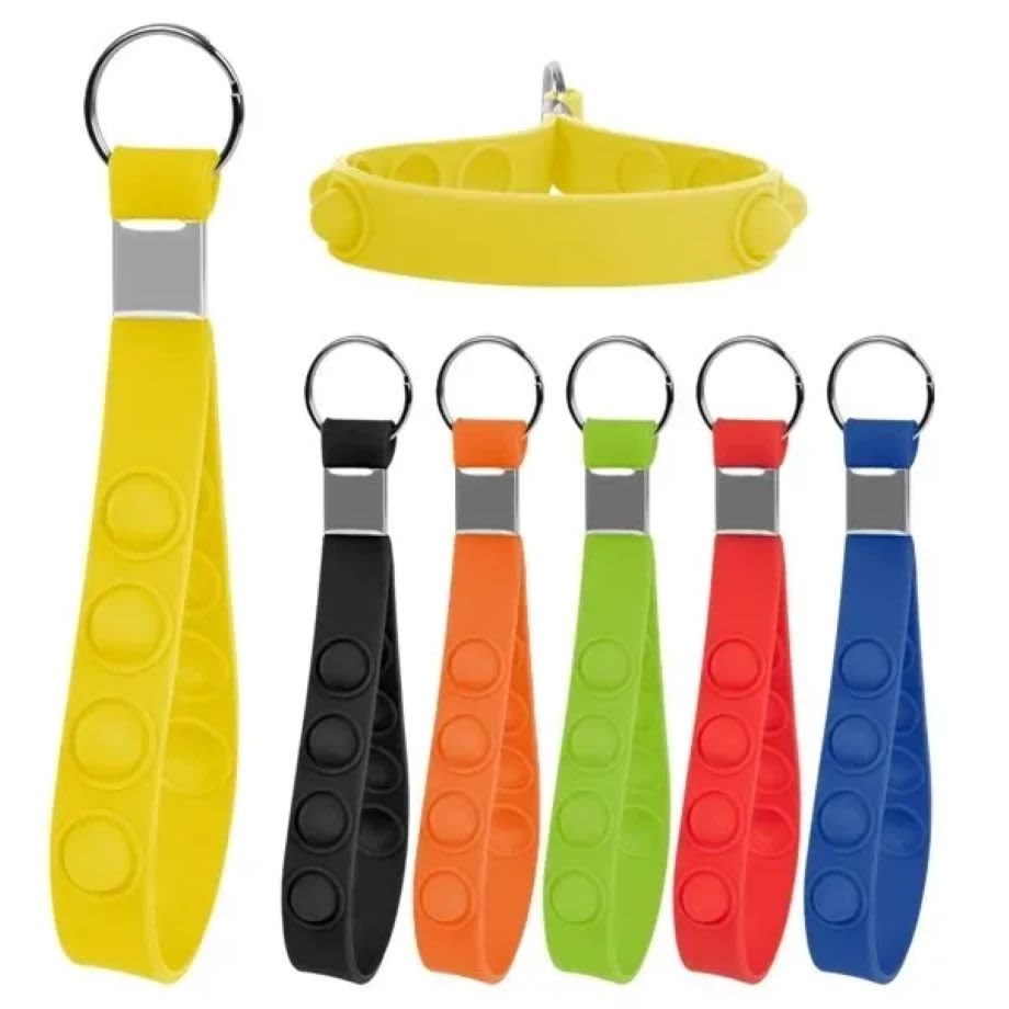 A collection of push pop stress reliever keychains in yellow, black, orange, green, red, and blue, with a silver keyring. Push Pop Stress Reliever Keychain - Image 1