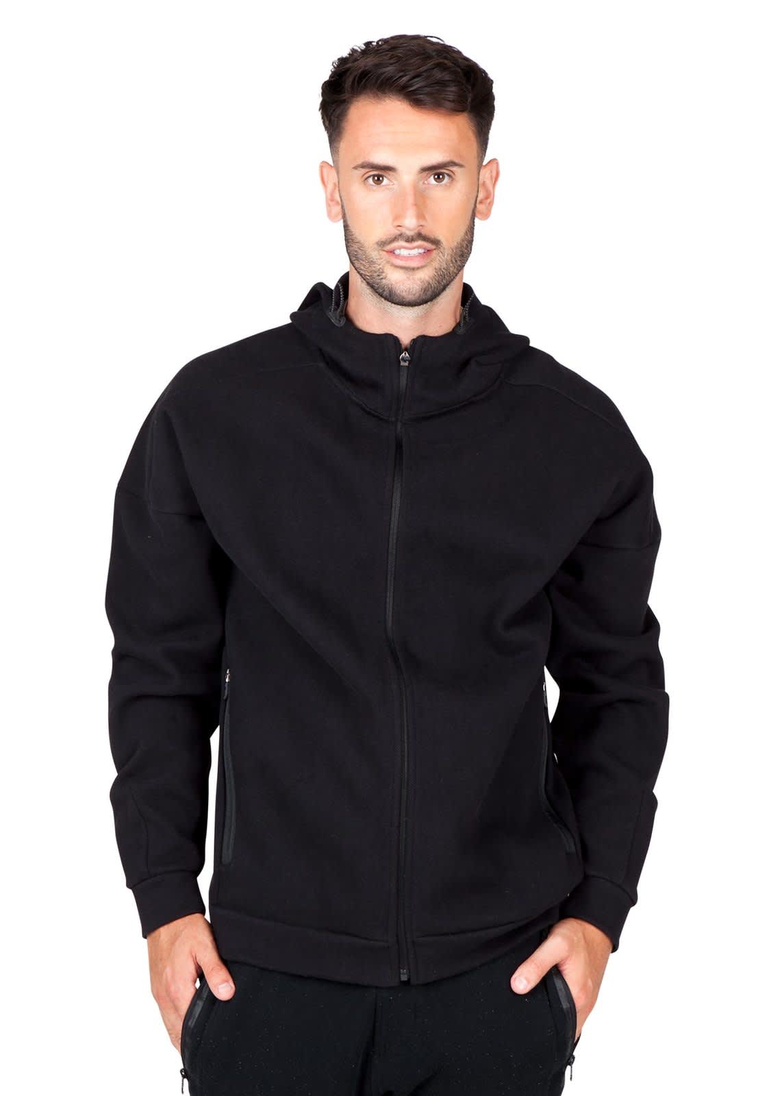 A black men's hoodie with a zip design, featuring a hood and side pockets. The model is standing against a plain background. Mens' SPACE hoodie - Image 1