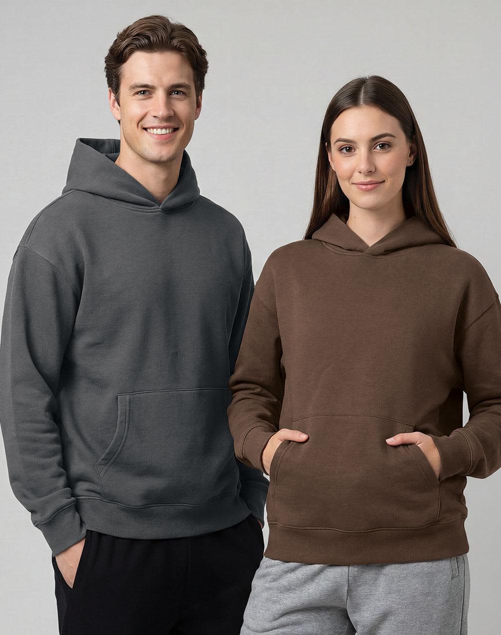 A grey unisex oversized hoodie and a brown unisex oversized hoodie, featuring a front pocket and a hood. Unisex Premium Fleece Oversized Hoodie - Image 1