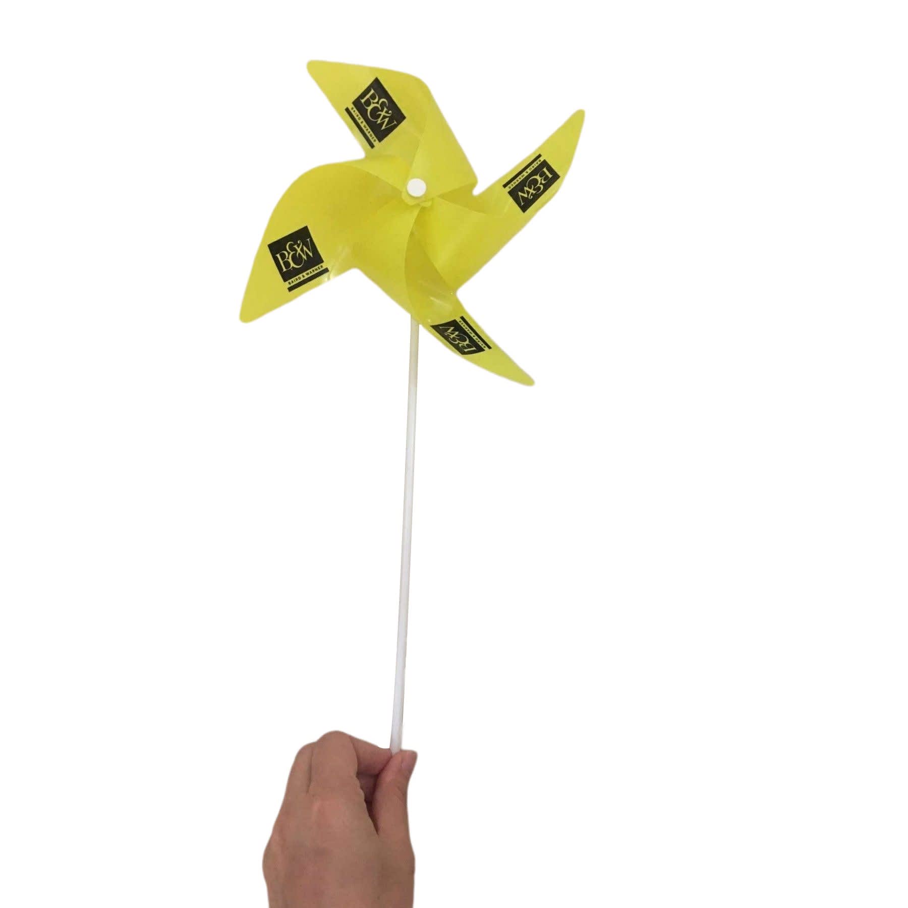 A yellow windmill toy with four blades, attached to a white handle, featuring a logo on each blade. Windmill Toy - Image 1