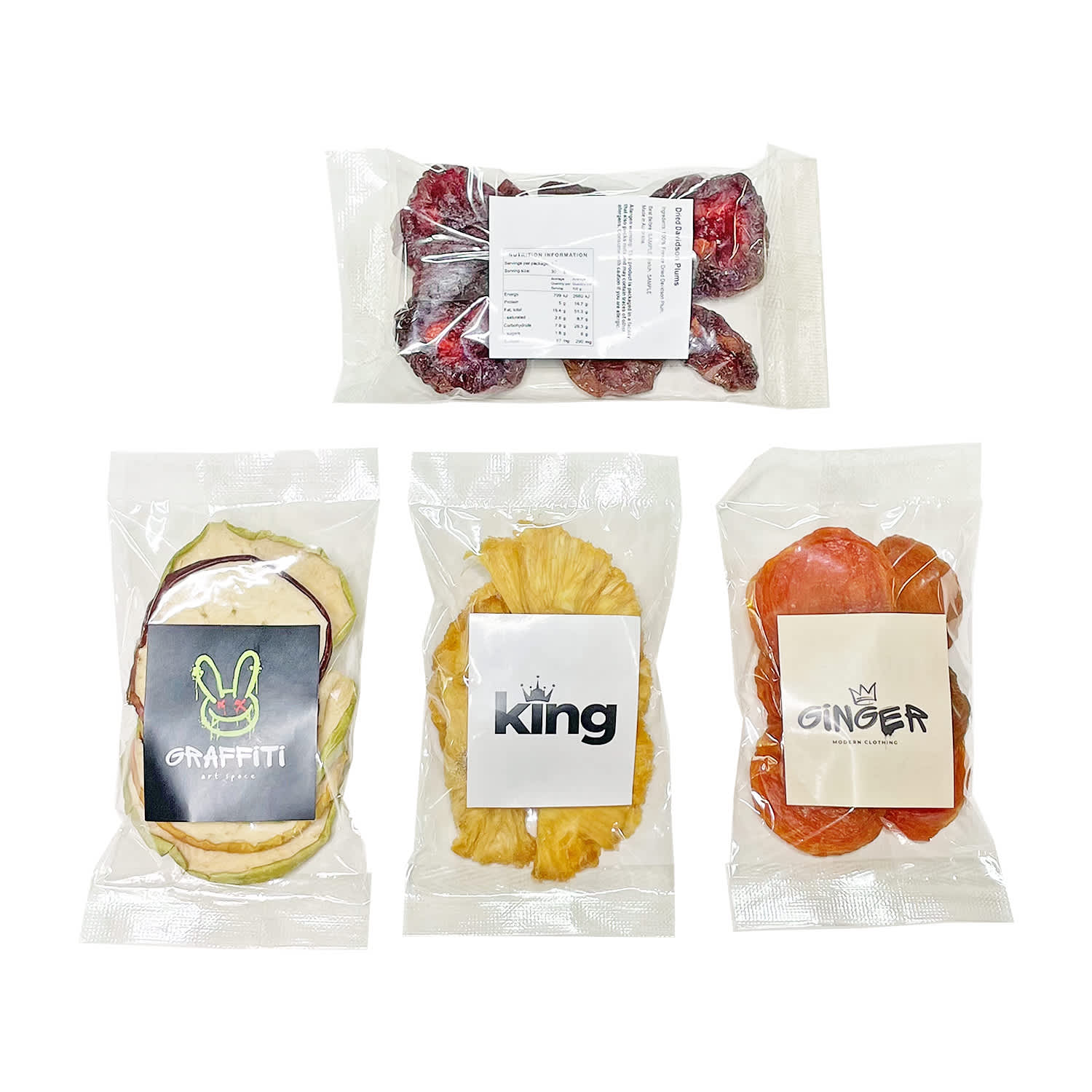 Dried fruit snack bags featuring assorted fruits in vibrant colours, packaged in clear wrappers with logos. Dried Fruit Snack Bag - Image 1