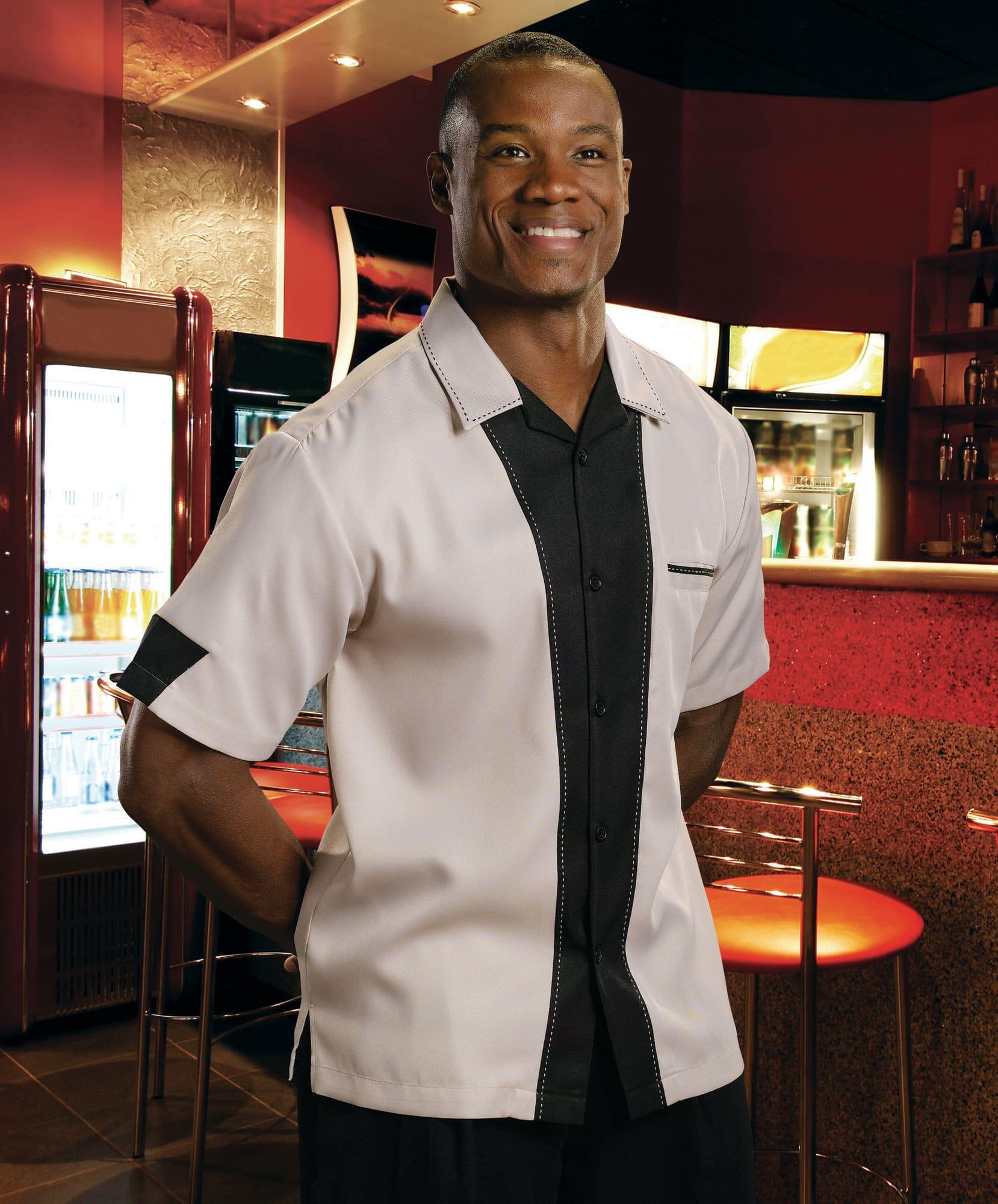 A short-sleeved button-up shirt featuring a cream and black colour scheme, with a subtle logo. Hilton Monterey Bowling Shirt - Image 1