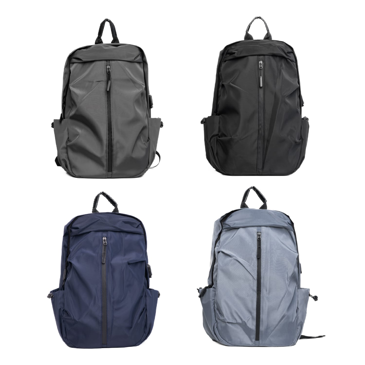 A collection of four backpacks in grey, black, navy, and light grey, each featuring a front zipper and branding. Drift Backpack - Image 1