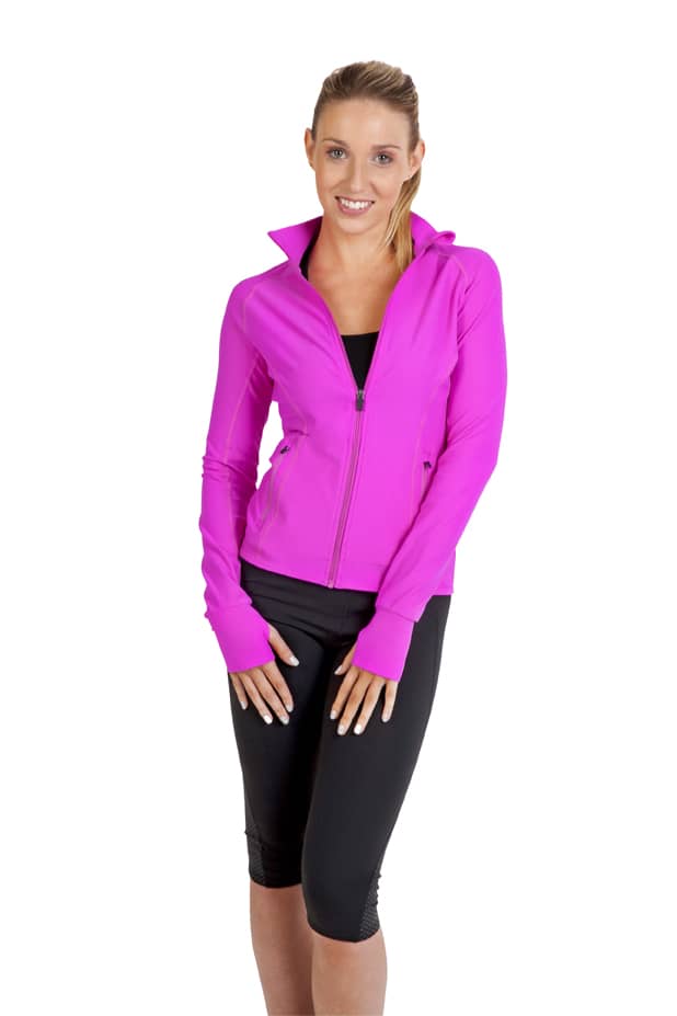 A woman wearing a bright pink nylon/spandex jacket with a zip and long sleeves, styled with black leggings. Womens AVA Nylon/Spandex Jacket - Image 1