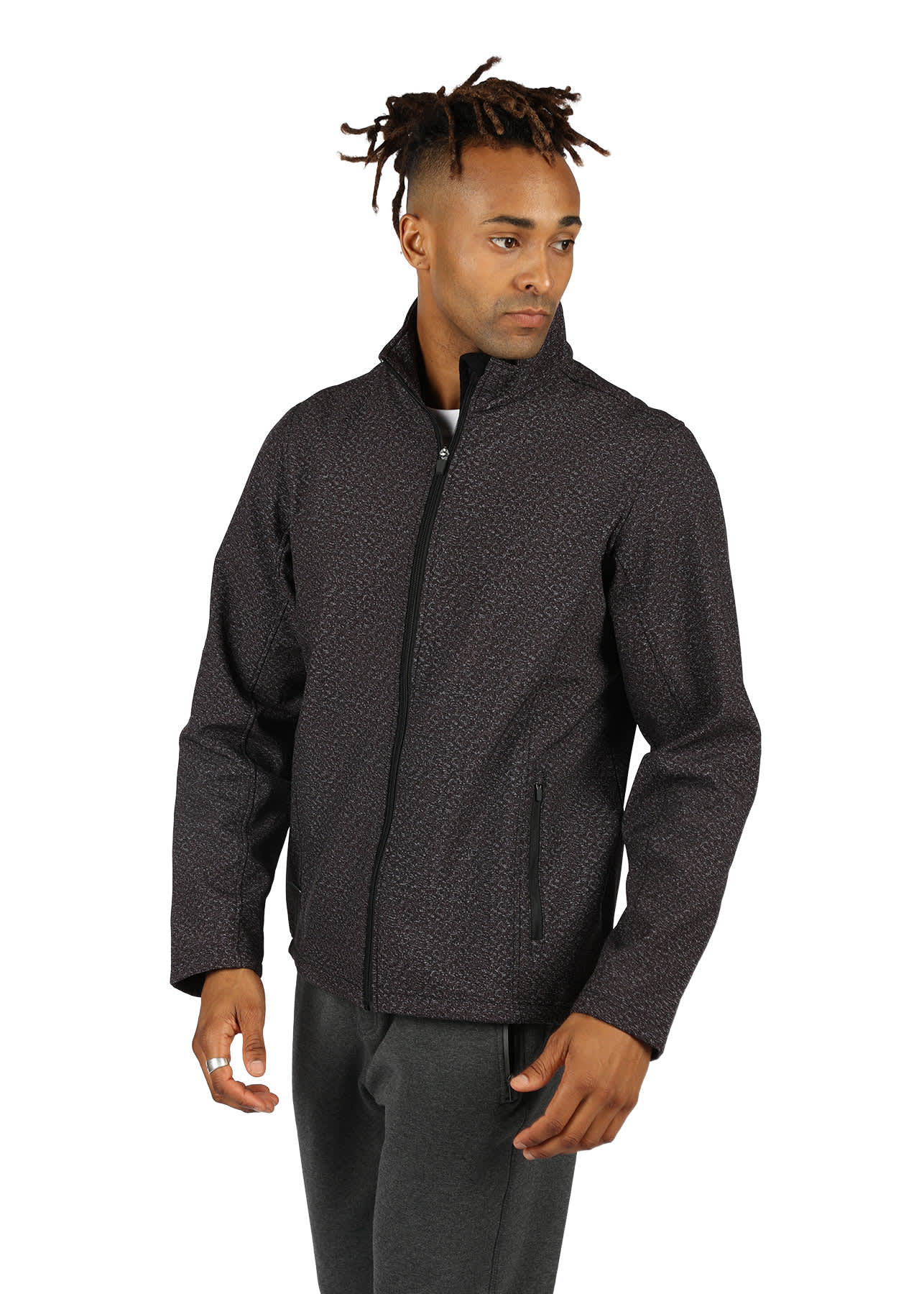 A man is wearing a black patterned soft shell jacket with a zip front and pockets. The jacket features a logo. Mens Tempest X Heather Soft Shell Jacket - Image 1