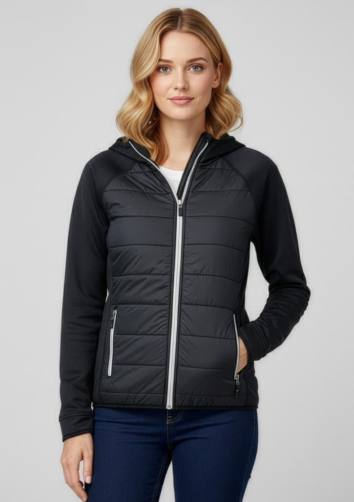 A stylish black women's puffer jacket with a hood, featuring zippered pockets and a fitted design. Womens Stealth Jacket - Image 1
