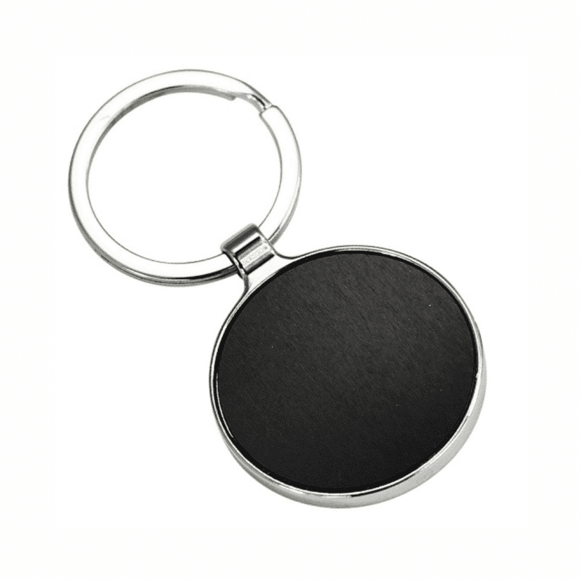 A round keychain with a silver ring and a black, smooth surface. No visible branding is present. Edison keyring - Image 1