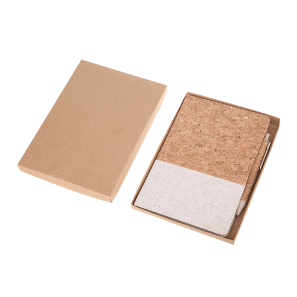 A cork notebook with a textured white cover, presented in a kraft cardboard box, includes a pen. Thomas Notebook - Image 1