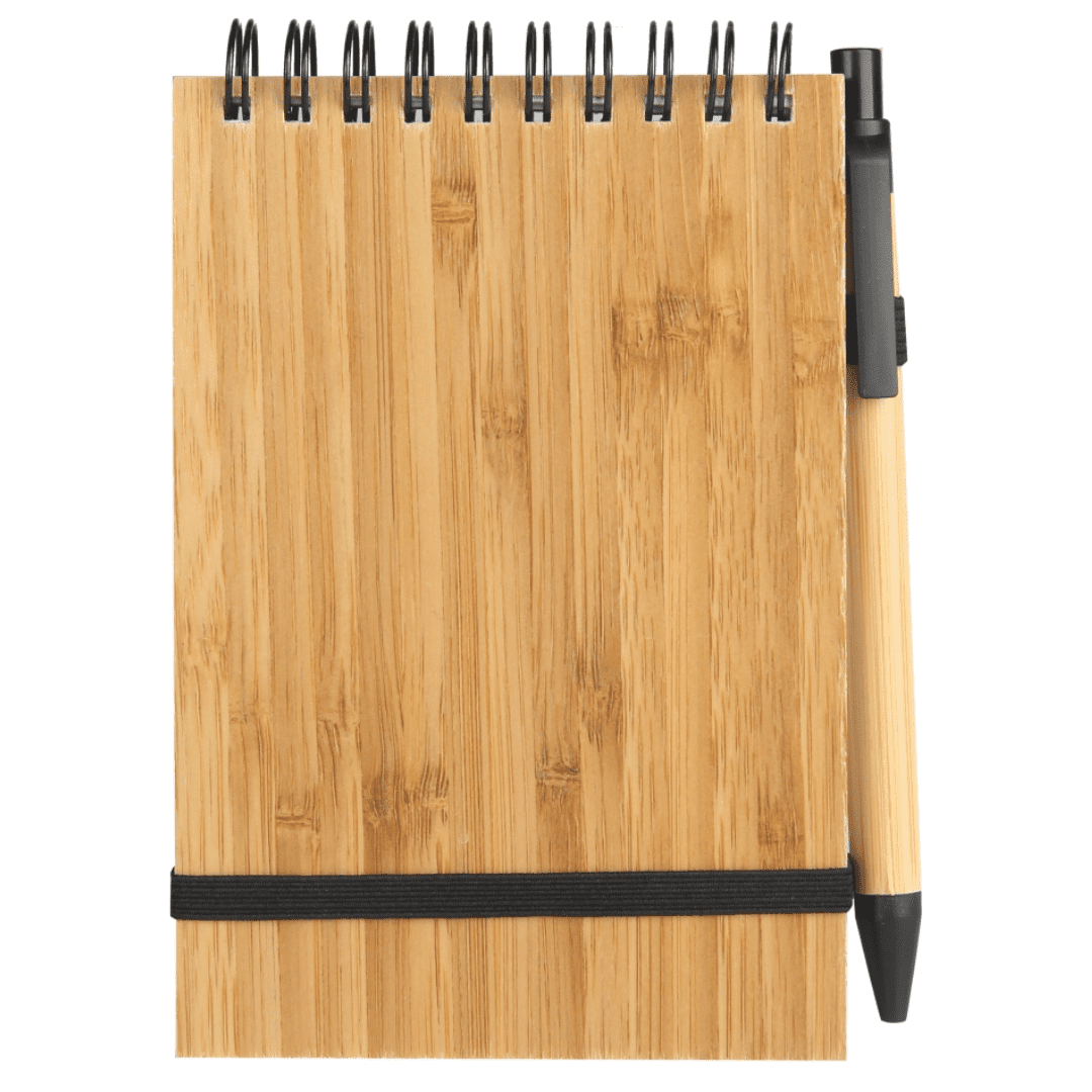 A bamboo notebook with a black band and a pen attached, featuring a spiral binding. Tucker Notebook - Image 1