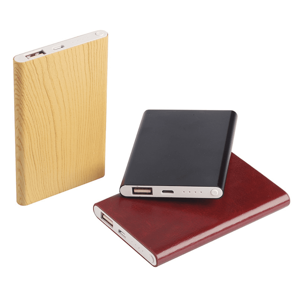 A collection of three powerbanks in wood, black, and burgundy finishes, each featuring a logo. Tokyo Power bank - Image 1