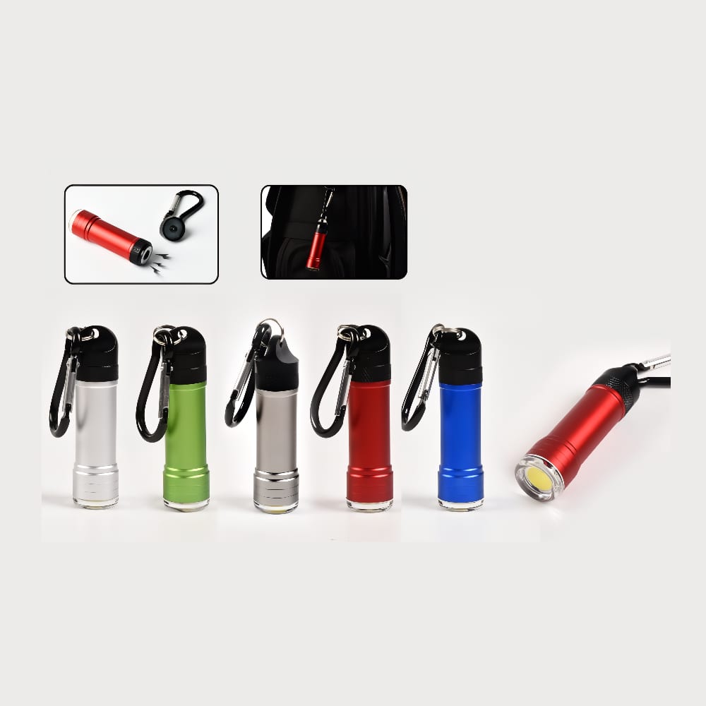 A collection of small torches in red, green, silver, and blue, each with a carabiner attached. Wilkinson torch - Image 1