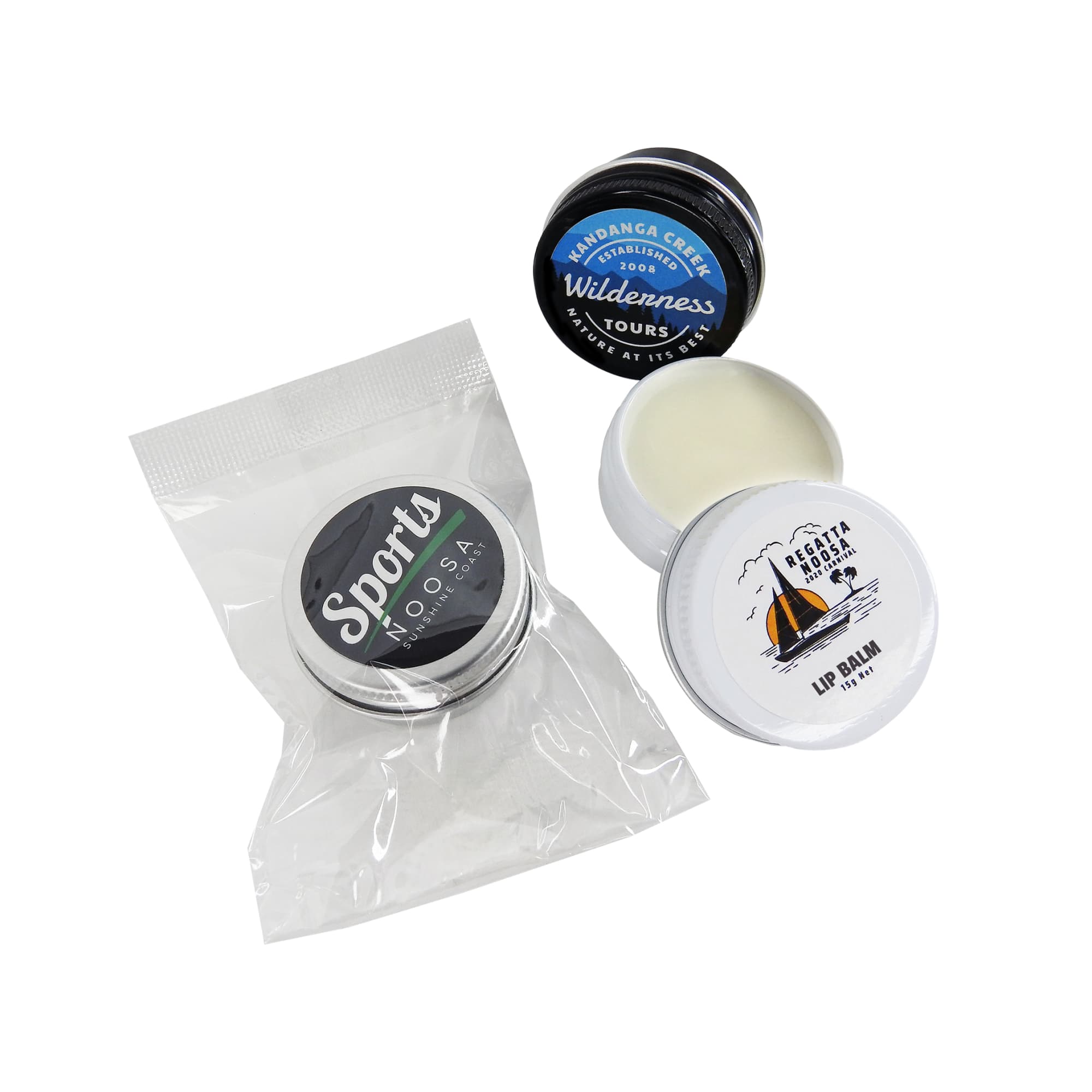 A collection of three twist-top tins, including a white lip balm and two additional tins, one with a black lid. Lip Balm Twist-Top Tin - Image 1