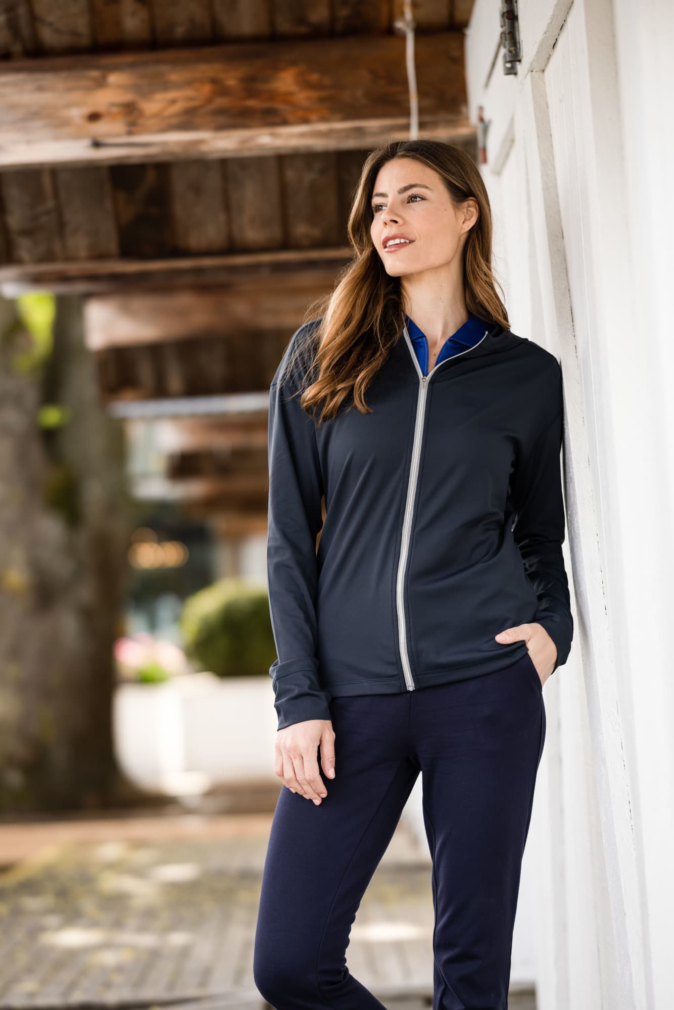 A navy full zip hoodie on a model, featuring a light zipper and a casual, comfortable design. Ladies Daybreak Full Zip Hoodie - Image 1