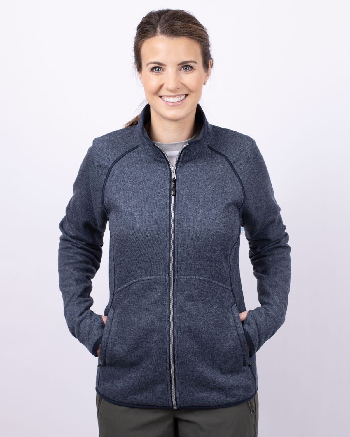 A full zip jacket in navy blue, featuring a sporty design and pockets, suitable for women's outerwear. Ladies Mainsail Full Zip Jacket - Image 1