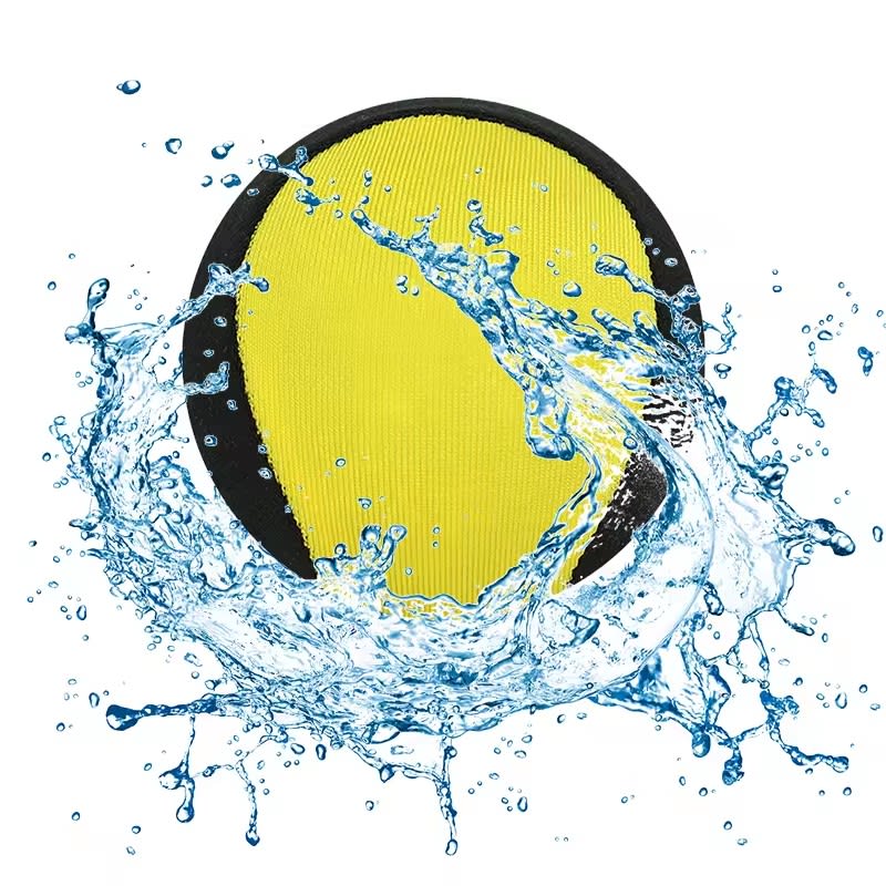 A yellow and black water skip ball surrounded by splashes of water, featuring a logo on the surface. Water Skip Ball - Image 1