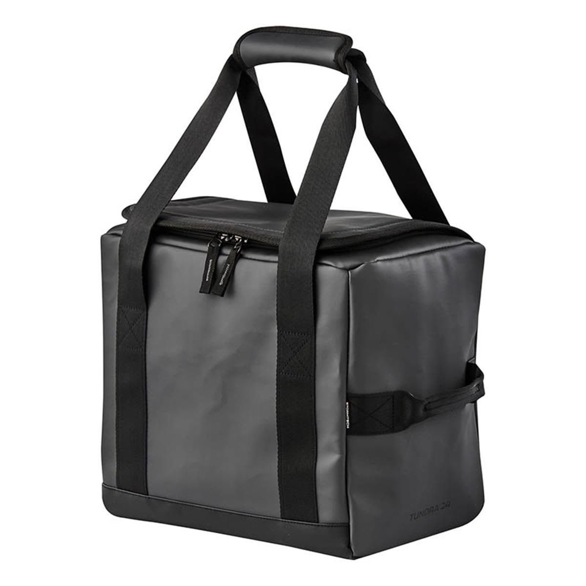 A black cooler bag with sturdy handles and a zippered top, featuring a logo. Ideal for transporting drinks. Tundra 24 Can Cooler Pack - Image 1