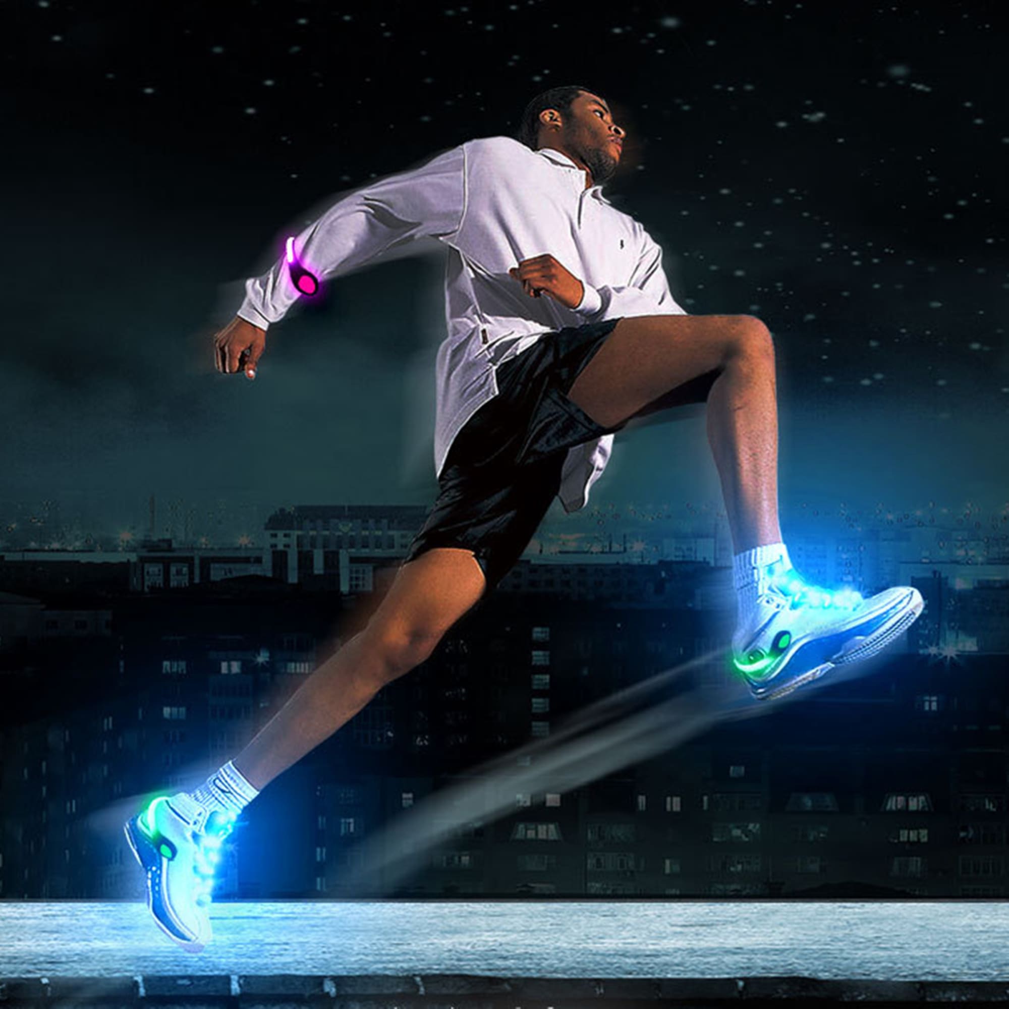 A runner in a white jacket and black shorts wears vibrant LED clip-on shoe lights, illuminating the scene in various colours. LED Clip-on Shoe Light - Image 1