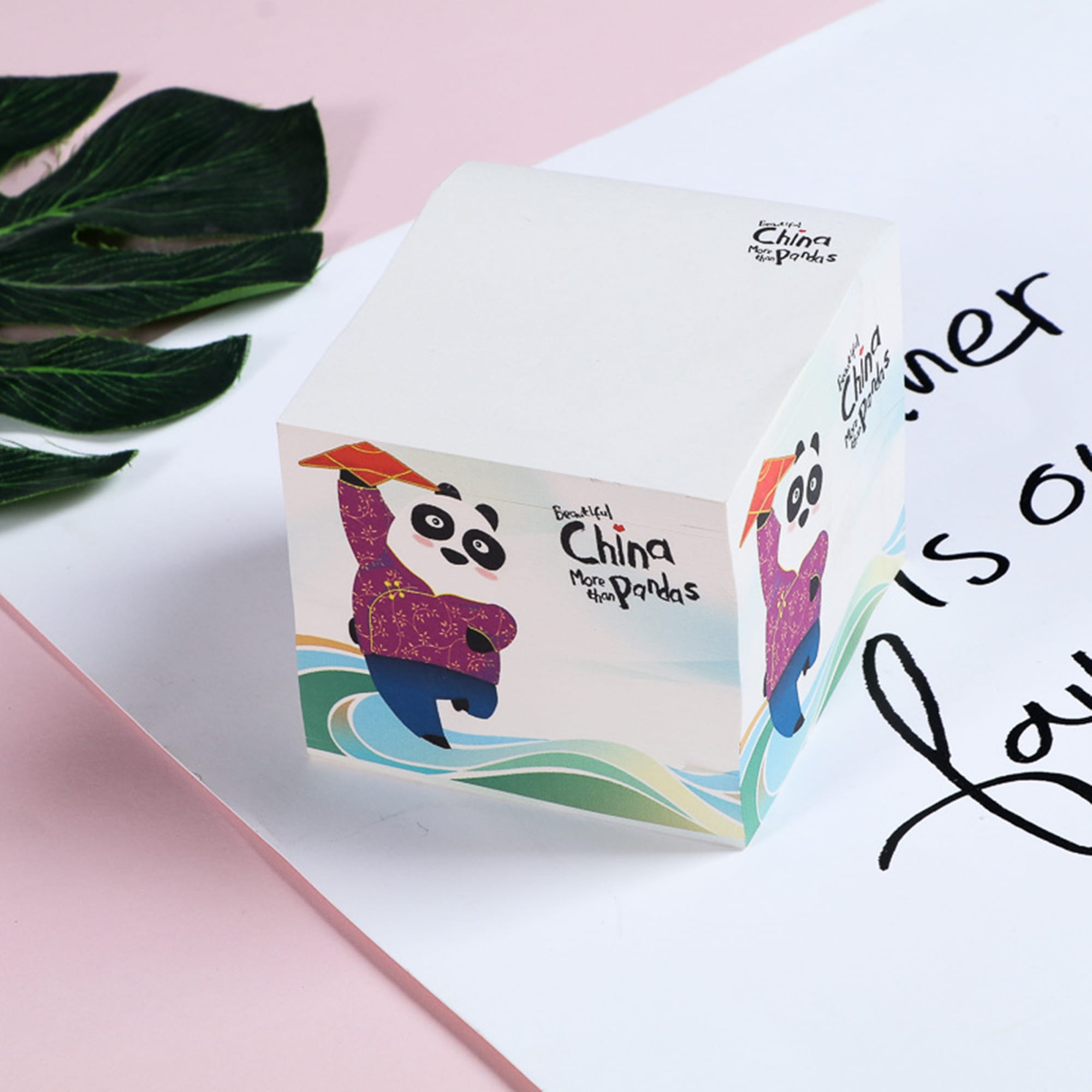 A square cube of sticky notes featuring a panda design, predominantly in white with colourful accents. Square Post-it Cube Notes - Image 1