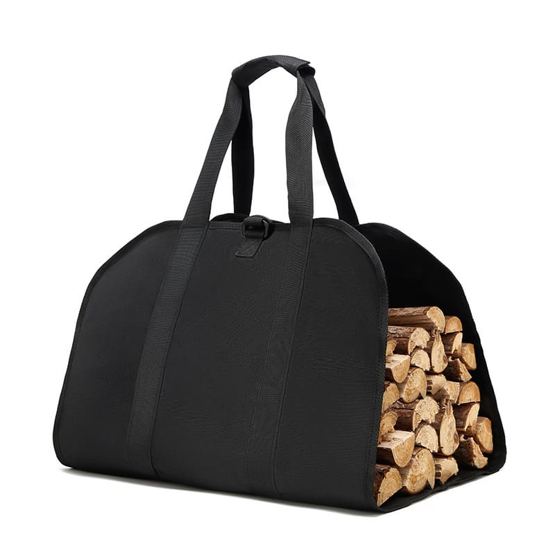A black log carrier tote bag filled with neatly stacked firewood, featuring two sturdy handles. Log Carrier Tote Bag - Image 1