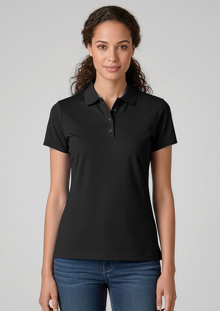 A black women's short sleeve polo shirt with a collar, featuring a logo on the chest. Model is wearing jeans. Womens Action Short Sleeve Polo - Image 1