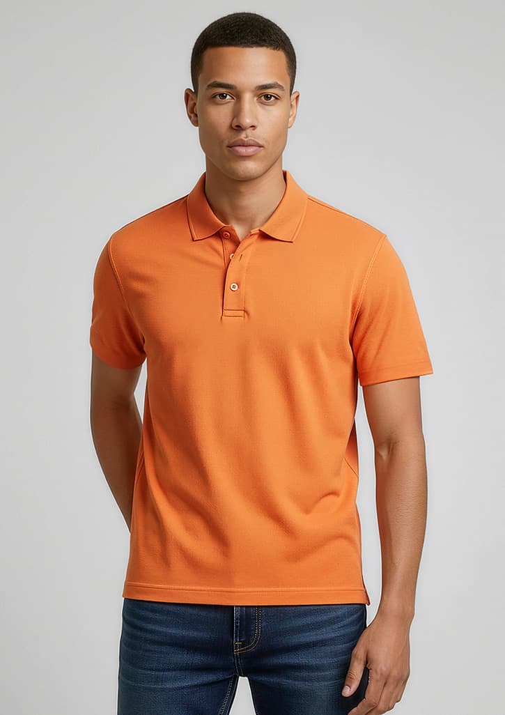 An orange polo shirt with a collared neckline, featuring a logo, worn by a model against a neutral background. Mens Crew Short Sleeve Polo - Image 1