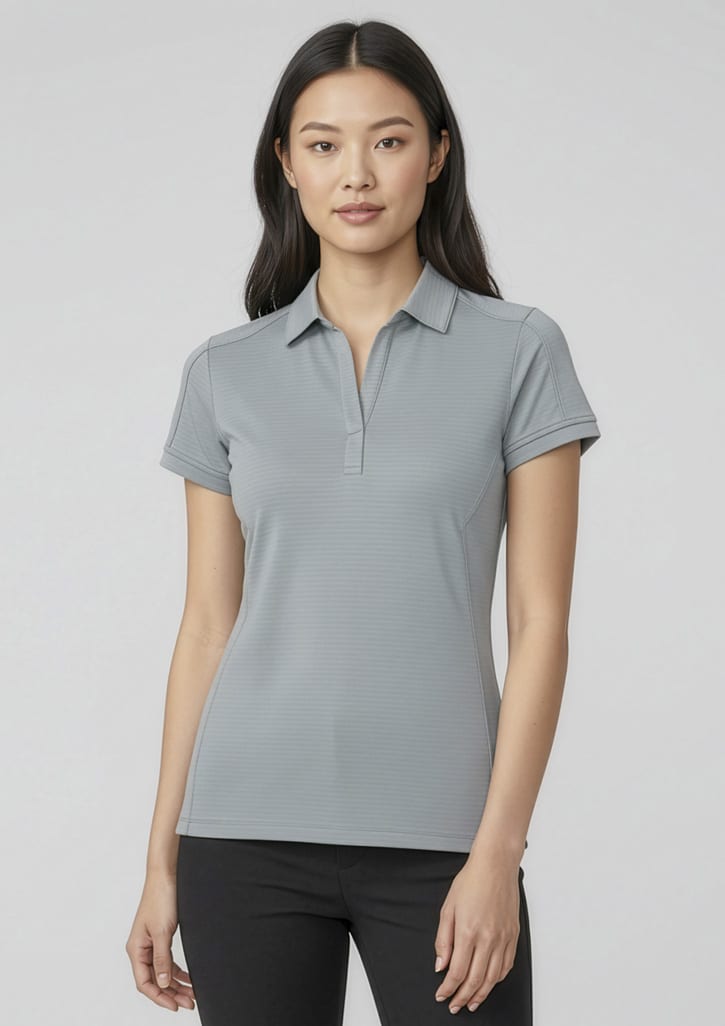 A women's short sleeve polo shirt in grey, featuring a classic collar and fitted design. It has a logo on it. Womens Profile Short Sleeve Polo - Image 1