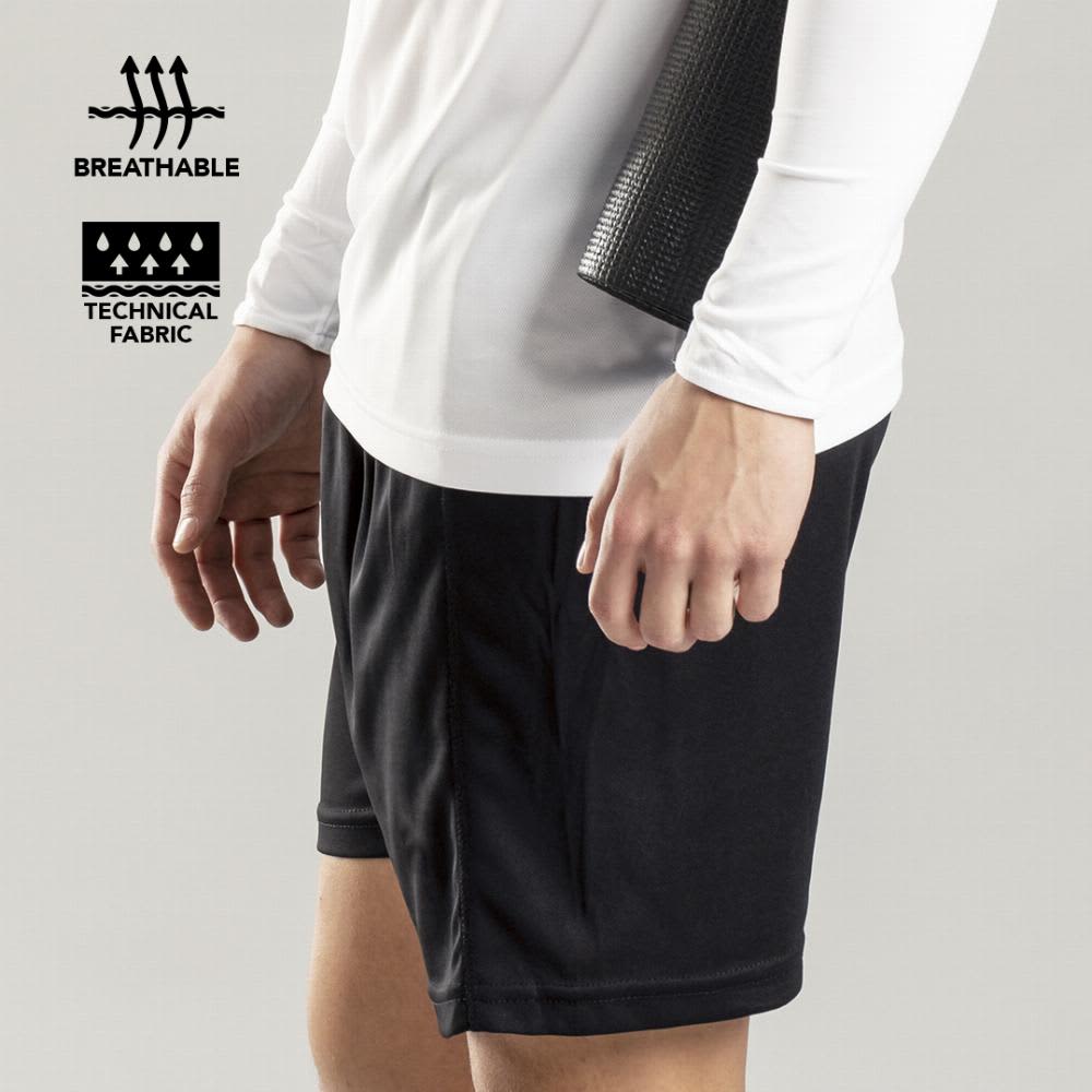 A pair of black sports shorts worn by a person, featuring breathable and technical fabric. Tecnic Gerox - Image 1