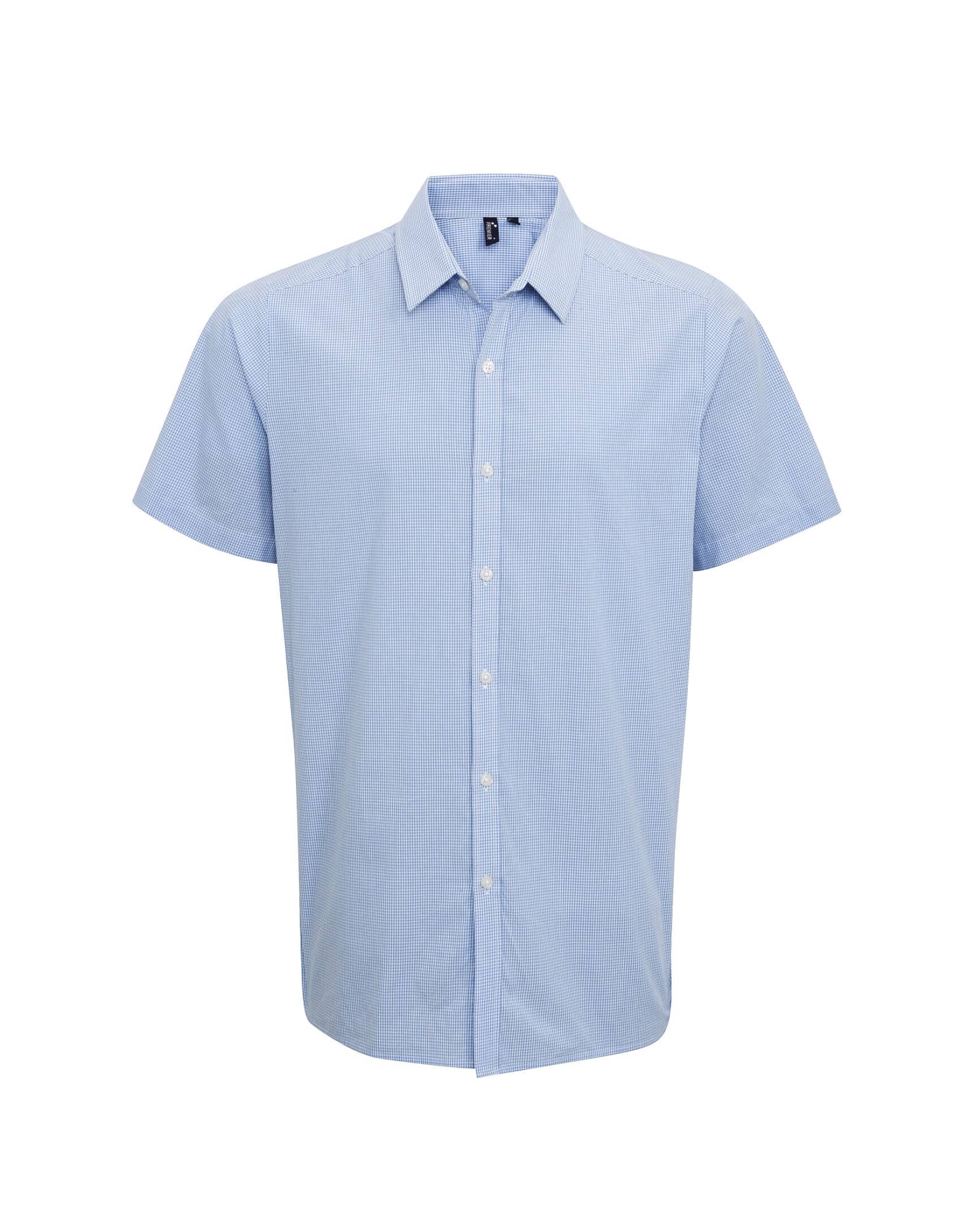 A blue microcheck short-sleeve button-up shirt with a collar and a logo on the chest. Microcheck S-S Cotton Shirt - Image 1