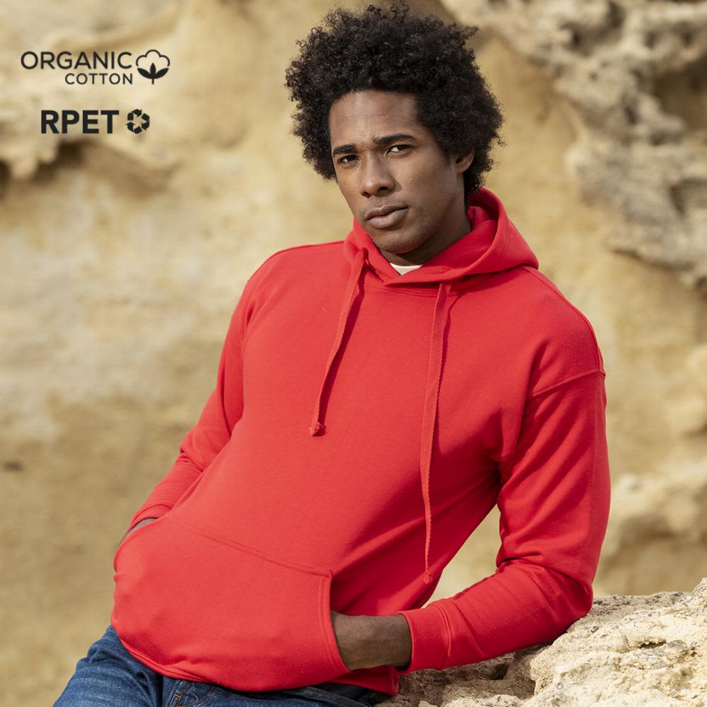 A red hoodie worn by a model, set against a natural rock background. The hoodie has a logo visible. Harnix - Image 1