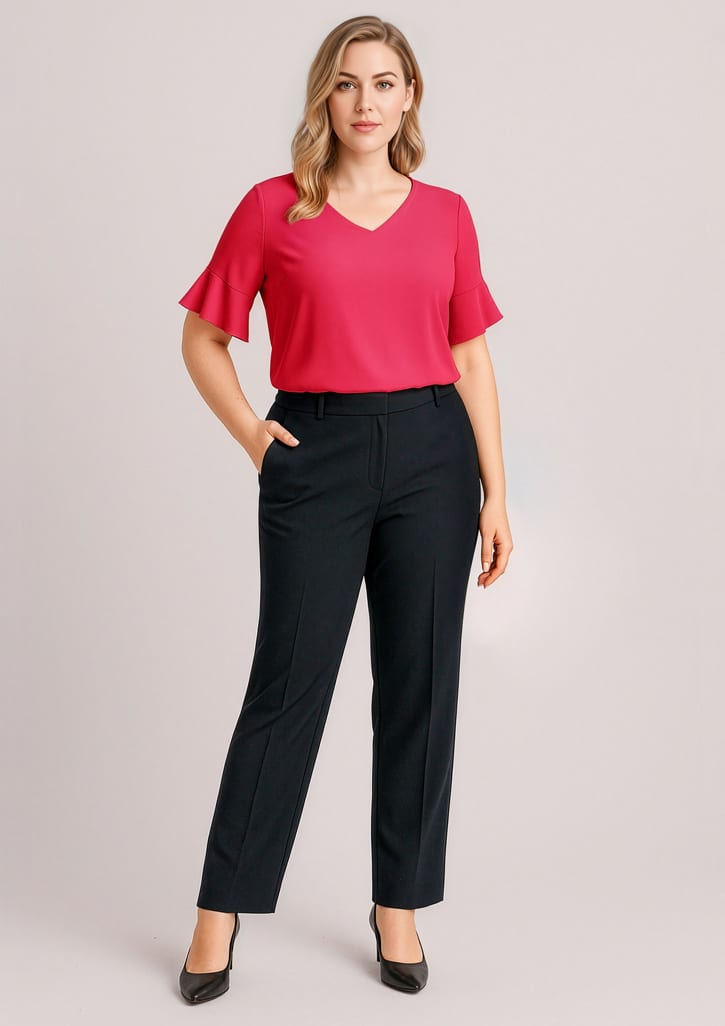 A woman wearing a pink top and black adjustable waist pants stands with one hand in her pocket. The pants have a sleek design. Womens Siena Adjustable Waist Pant - Image 1