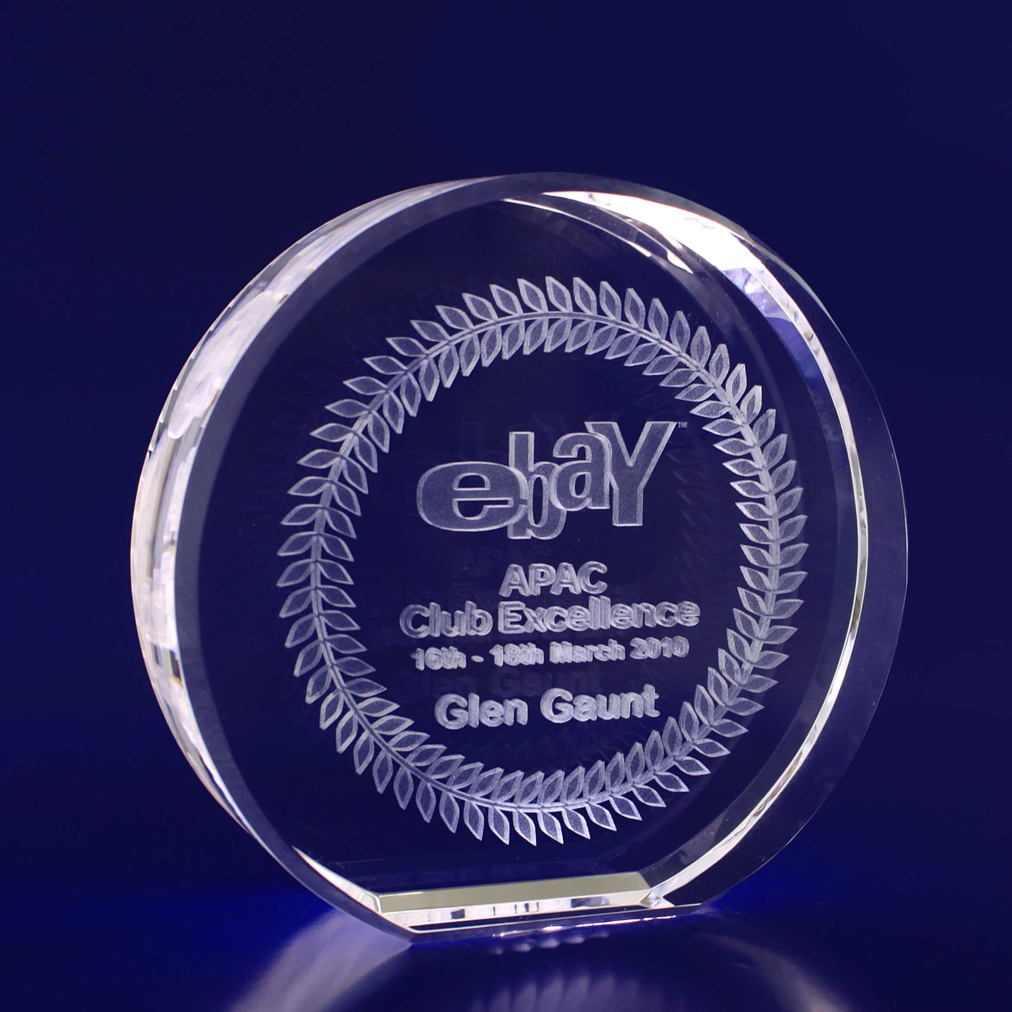 A 3D crystal round award with a 100mm diameter, featuring a clear design and engraved text. 3D Crystal Round (100mm diametre) - Image 1