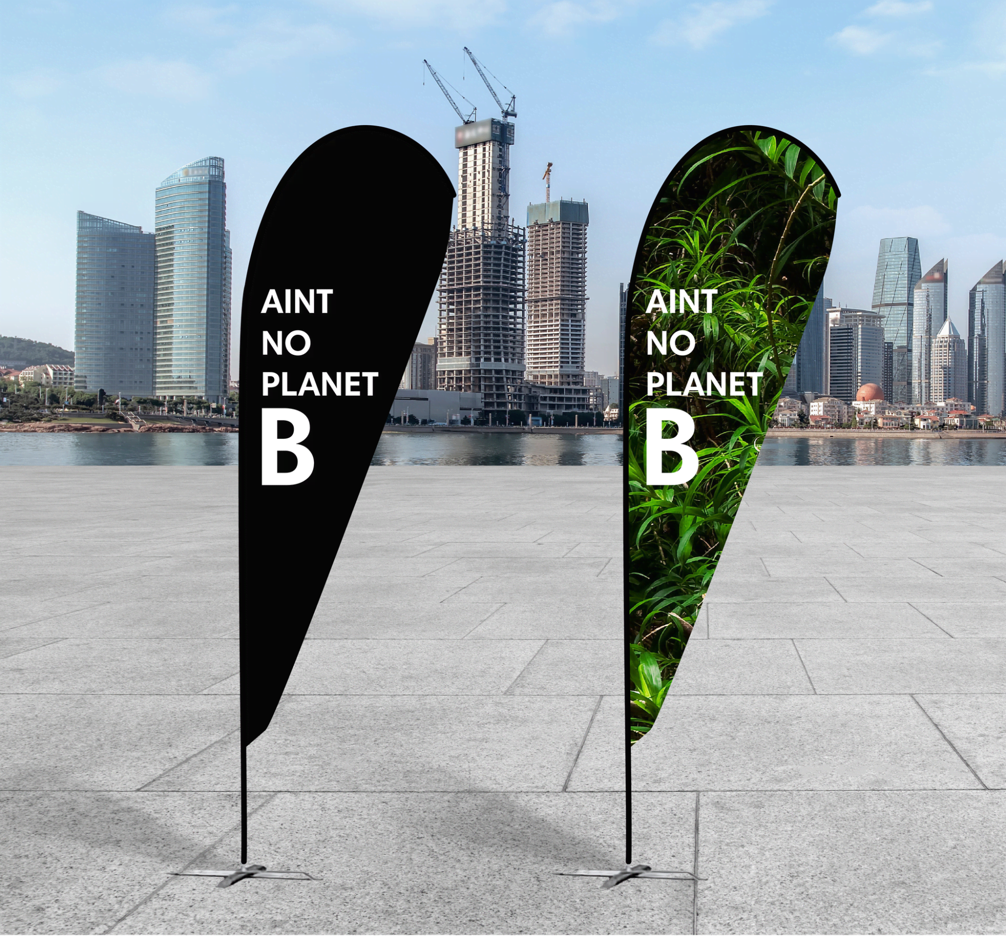 A black and green teardrop banner with a logo, featuring environmental themes, set against a cityscape background. rPET Teardrop Banner - Small - Image 1