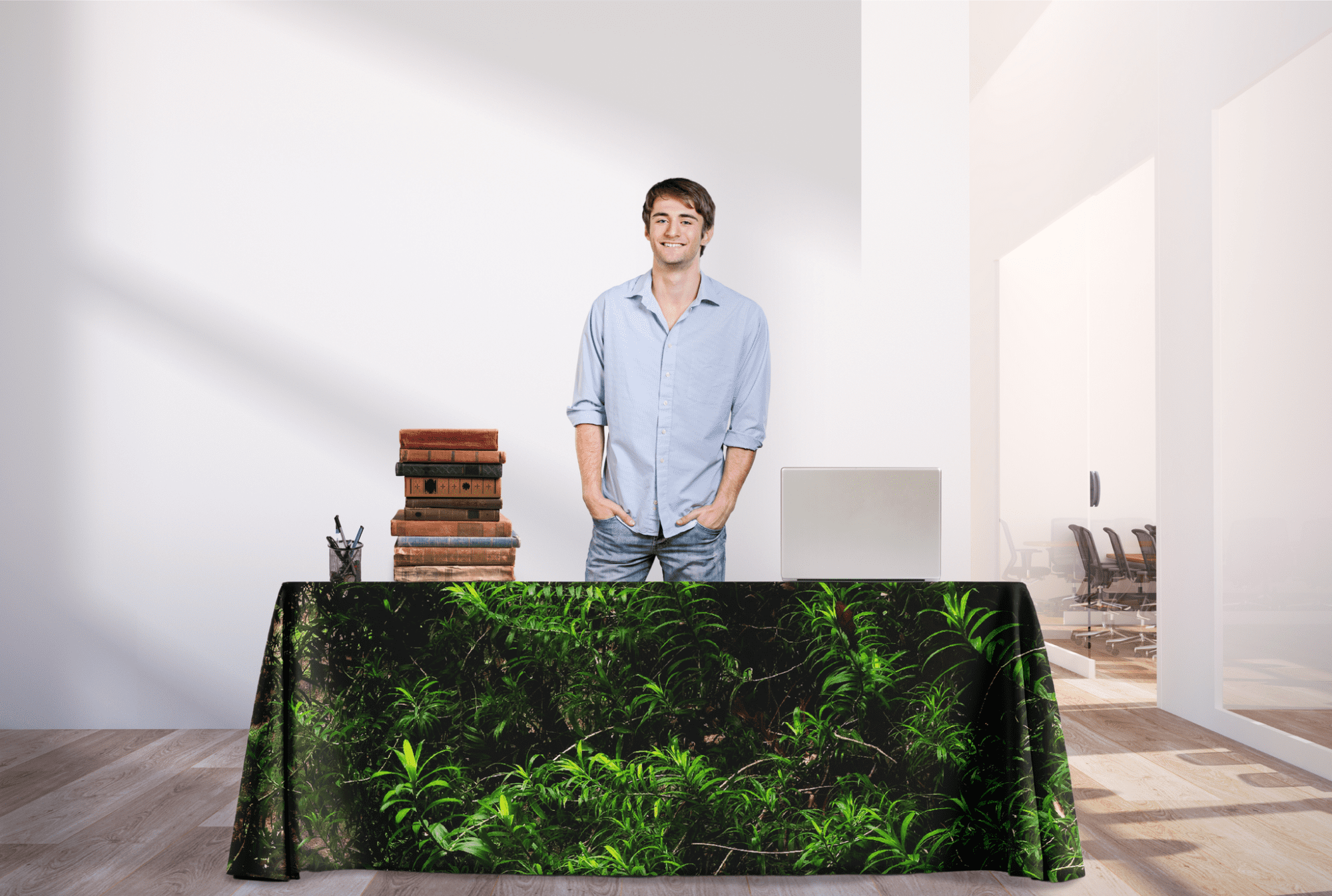 A 4ft table cover featuring a green plant design, placed on a table in a bright indoor setting. rPET Throw Table Cover 4ft (1200mm) - Image 1