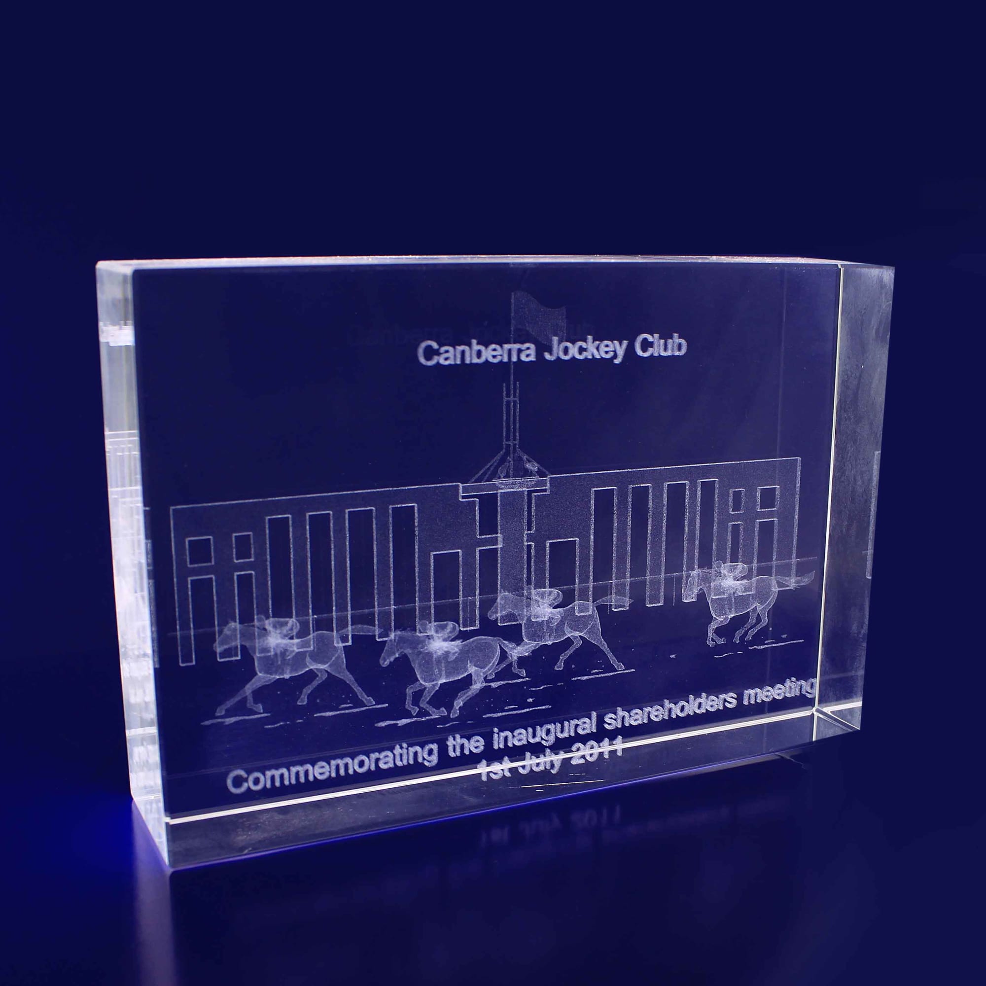A rectangular, clear crystal plaque featuring etched designs and text, with a sleek and modern appearance. 3D Crystal Rectangle Thin Medium (150mm) - Image 1