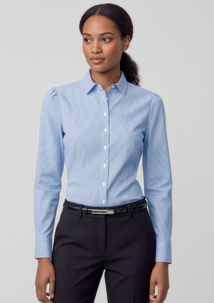 A women's long sleeve button-up shirt in light blue, featuring a collar and fitted design, paired with dark trousers. Womens Euro Long Sleeve Shirt - Image 1
