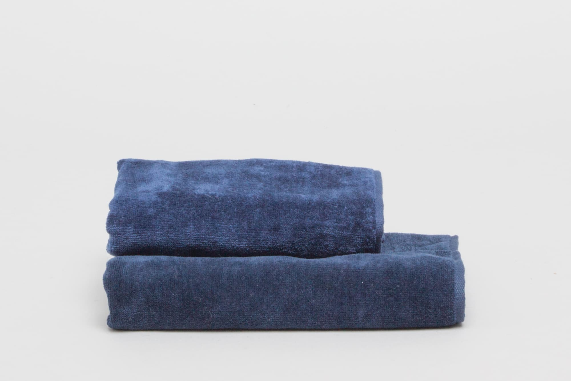 Two navy sports towels stacked, showcasing a soft texture and a branded design. Signature Sports Towel 380 gsm Navy - Image 1