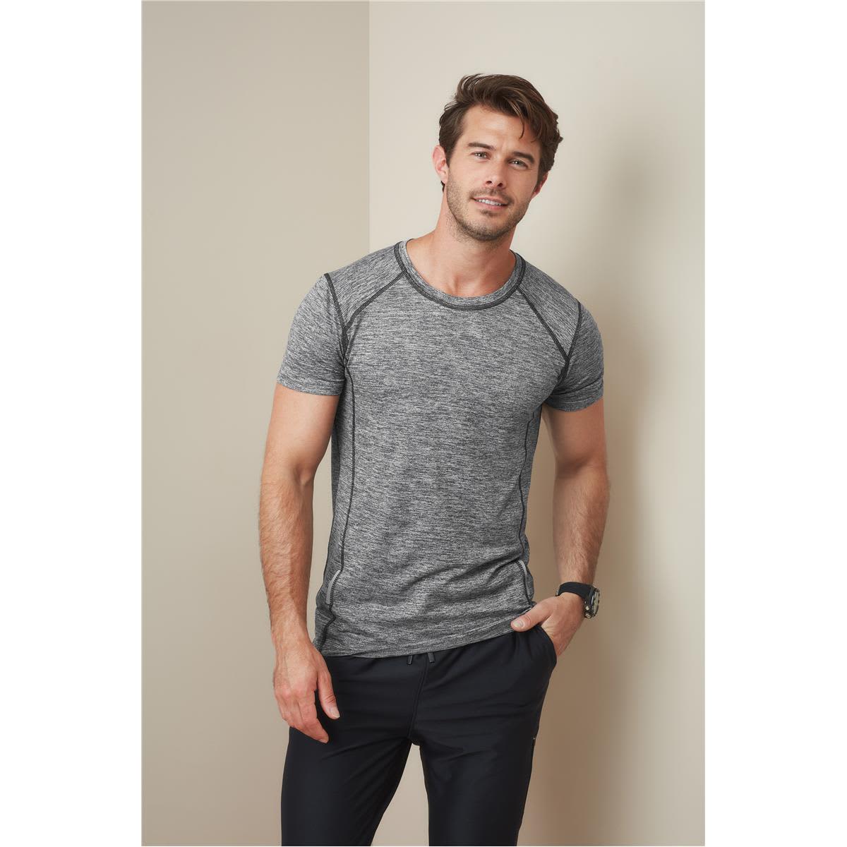 A grey marled men's T-shirt with contrasting seams, featuring a logo on the chest, paired with black trousers. Men's Recycled Sports-T Reflect - Image 1