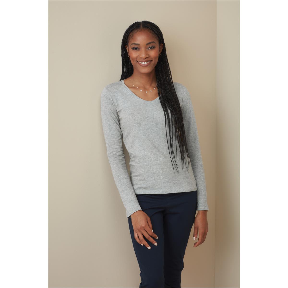 A grey long sleeve shirt with a V-neck, worn by a model with long, straight hair. Features a subtle logo. Women's Claire V-neck Long Sleeve - Image 1