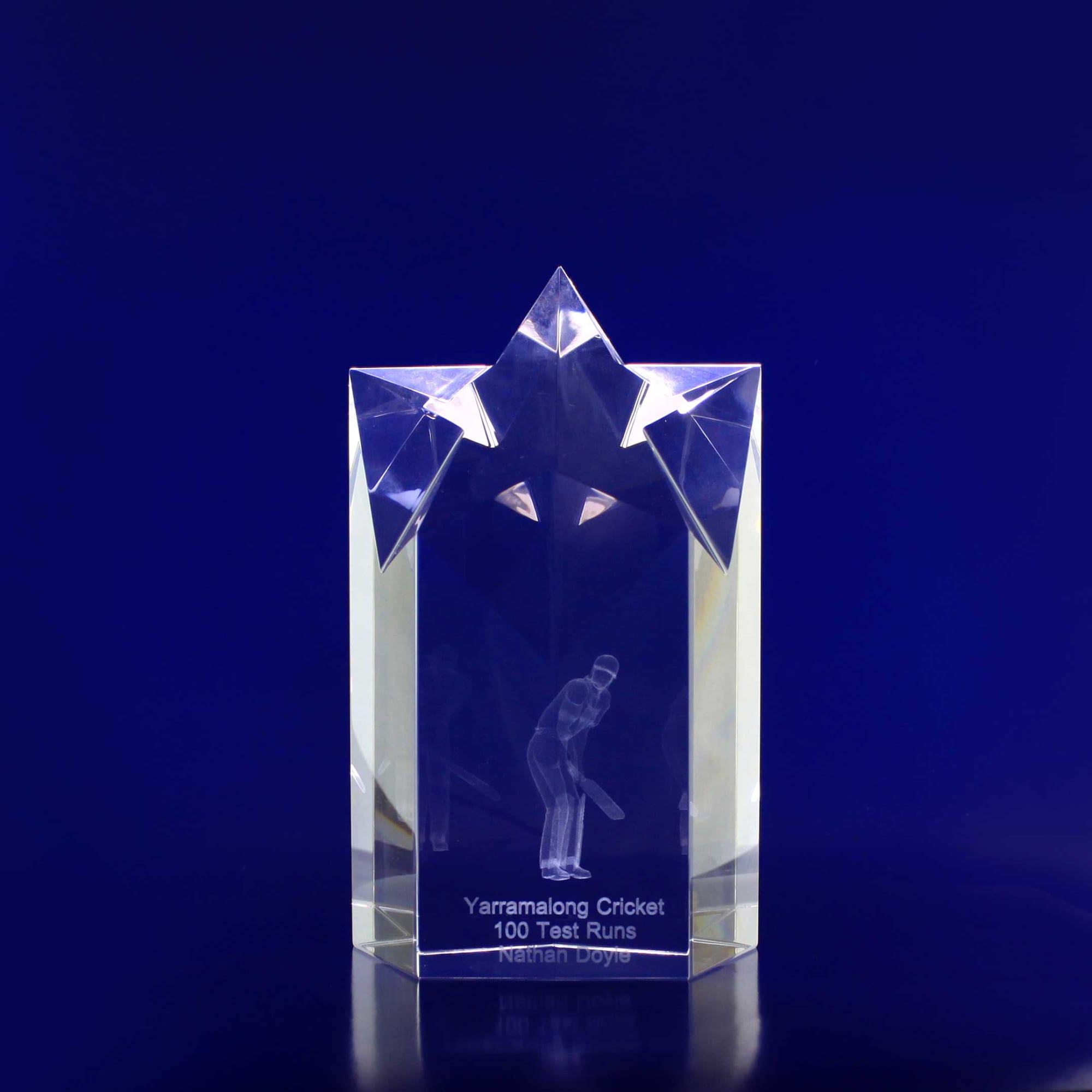 A clear crystal trophy in the shape of a star, featuring engraving and a logo. It reflects light beautifully. 3D Crystal Star Point (150mm) - Image 1