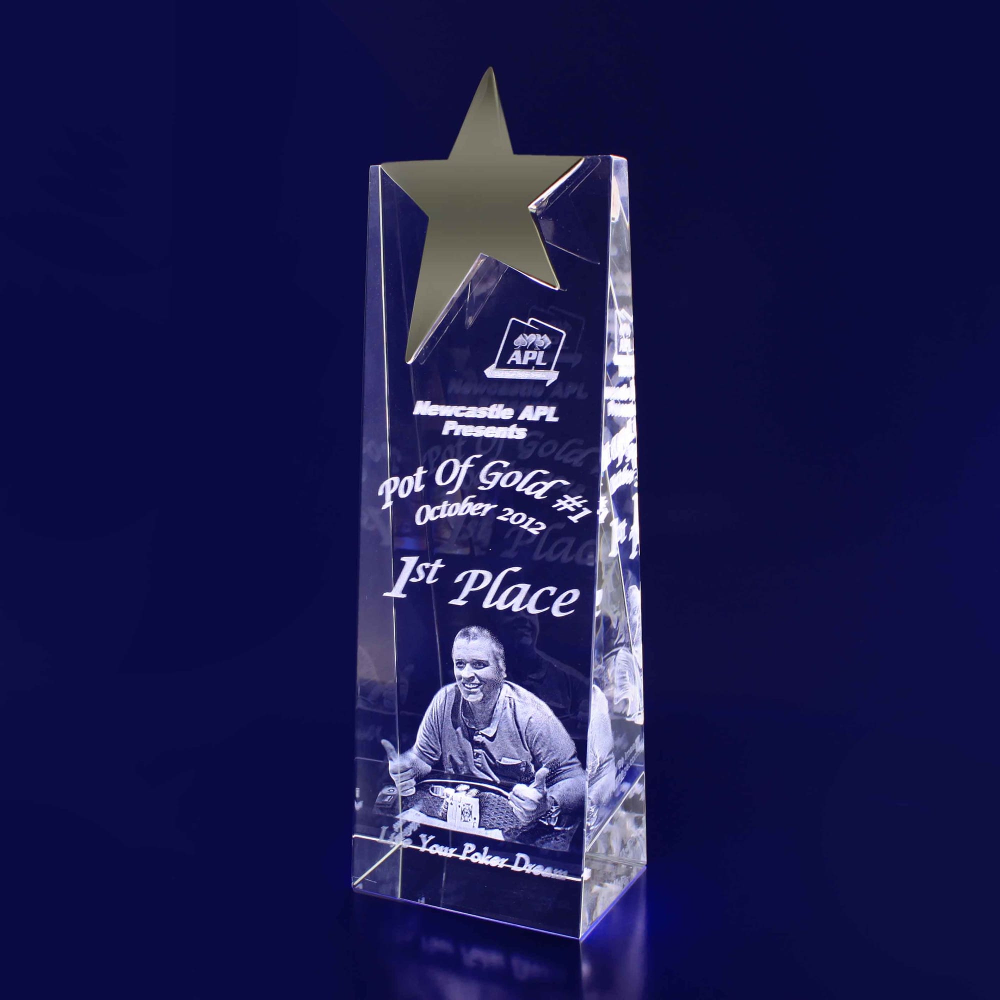 A 3D crystal star wedge trophy in clear with a star design on top, featuring engraved details. 3D Crystal Star Wedge (220mm) - Image 1